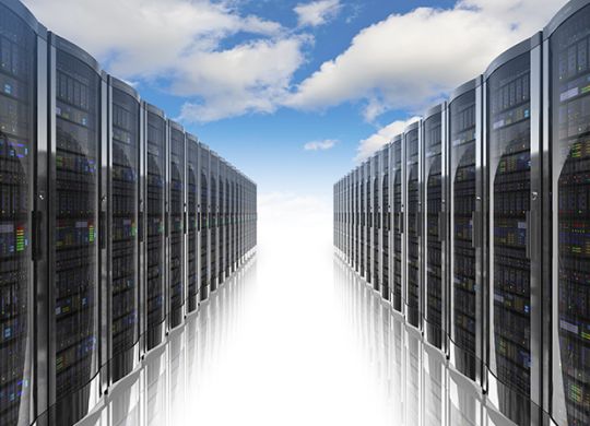 Cloud computing and computer networking concept: rows of network servers against blue sky with clouds