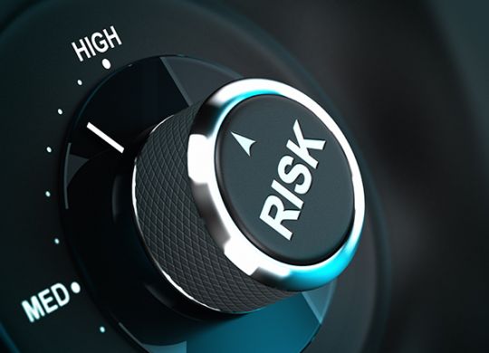 Button with the word risk pointing between medium and high level, 3D render suitable for risk management or decision-making process situation. Depth of field.